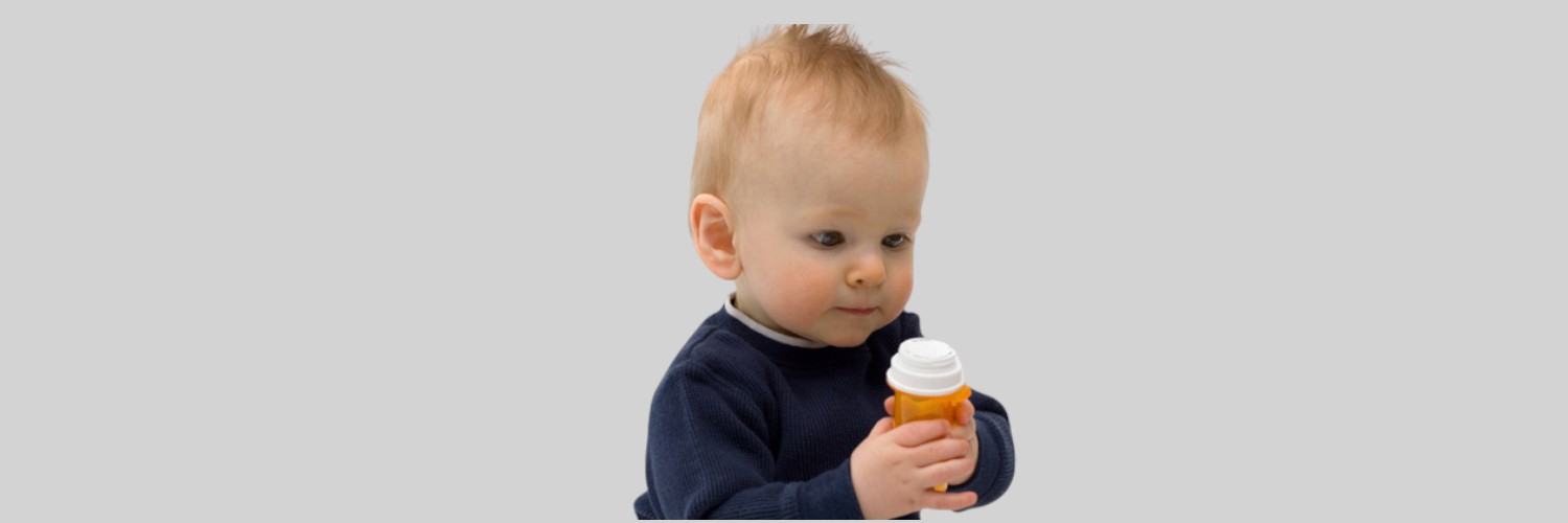 Baby reaching for colorful bottles on a low shelf, highlighting poison prevention awareness.