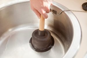 Different types of plungers for home plumbing repairs.