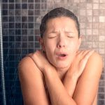 Girl feeling hot while bathing with aging water heater